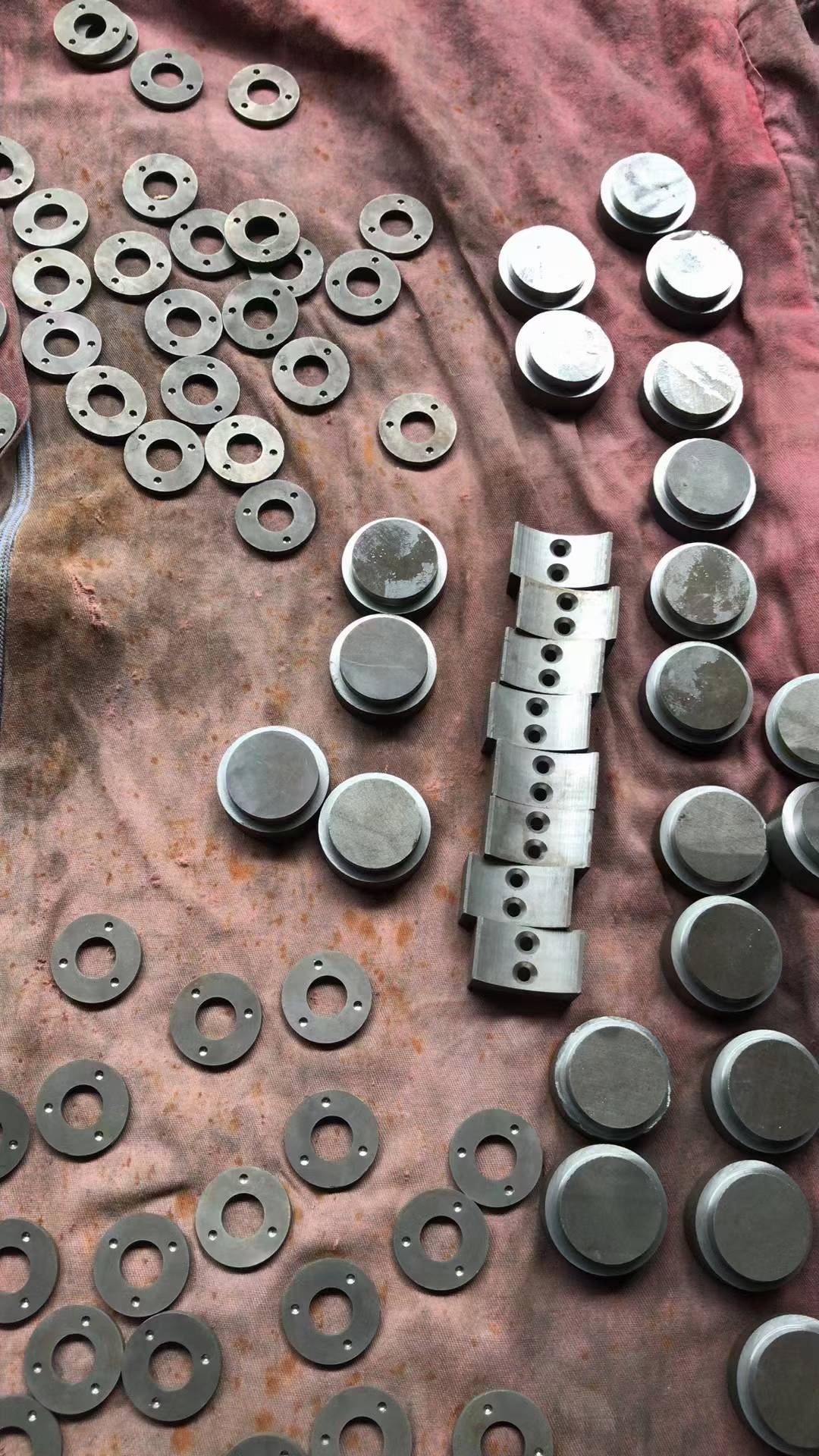 Machined ring, disc and arc magnet components before final processing
